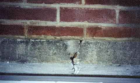 Photograph showing large crack and old repair.