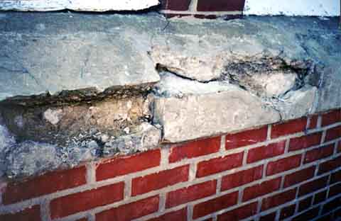 Photograph of extensive deterioration of a sill cap.